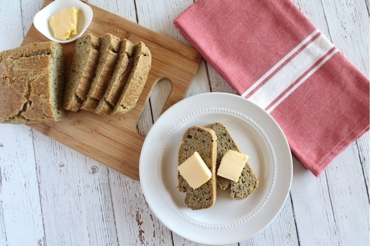 A plate with slices of bread and butter on it, perfect for a quick and simple snack or as an accompaniment to your favorite recipes.