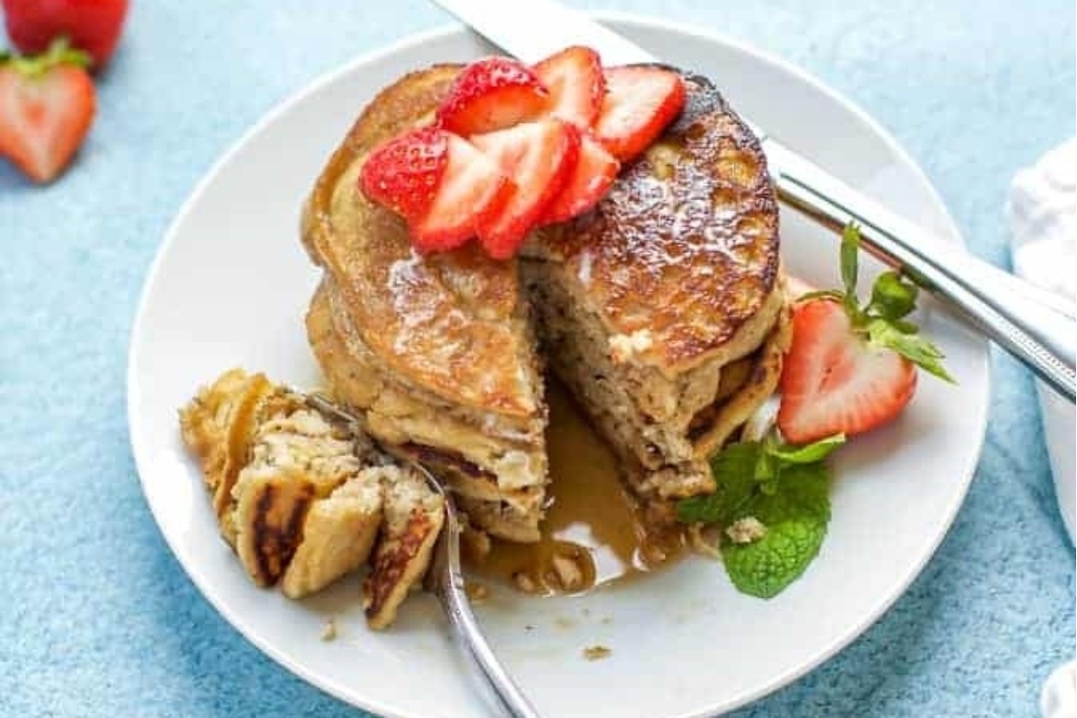 Christmas Pancakes with strawberries on a plate.