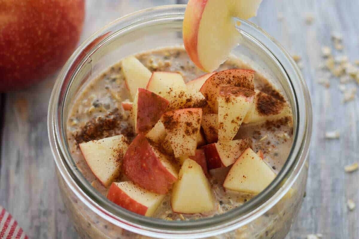 Cinnamon-spiced oatmeal served in a mason jar.