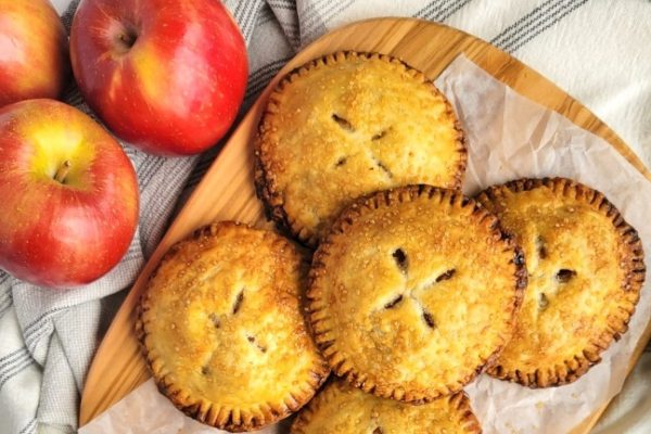 Apple hand pies with fresh apples on the side.