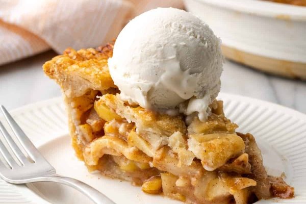 Apple pear pie with a scoop of ice cream.