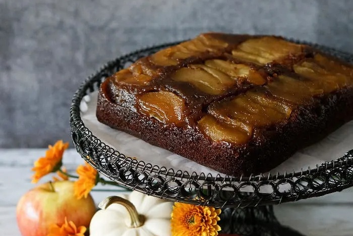 Caramel apple cake on a gingerbread flavored cake stand.