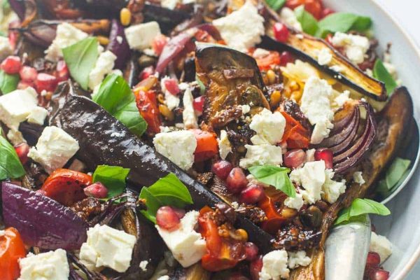 Colorful eggplant and pomegranate salad with feta.