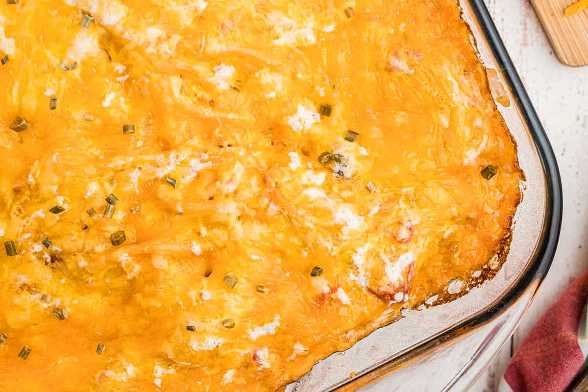 A casserole dish with cheese on it.