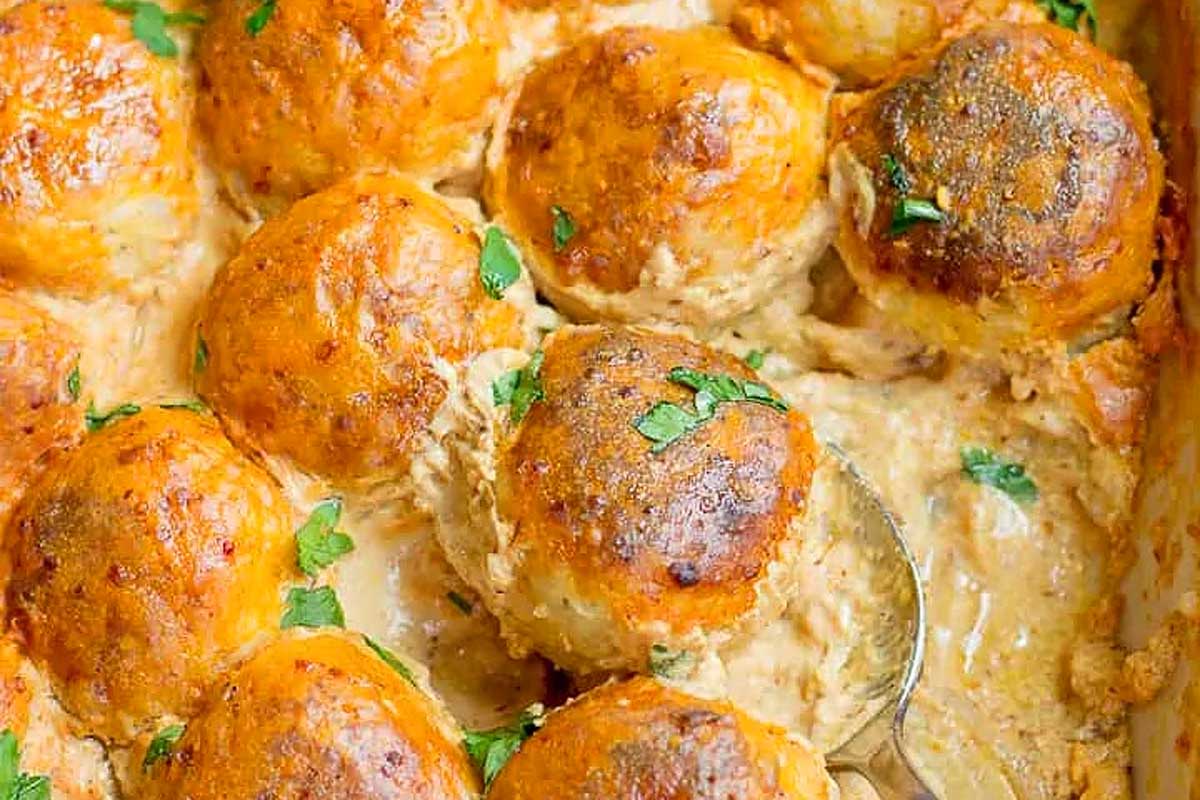 A casserole dish filled with mashed potatoes and gravy.