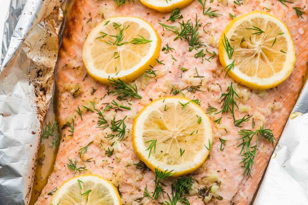 Salmon in foil with lemon slices and dill is a delicious MAINS dish that can be enjoyed for Thanksgiving.