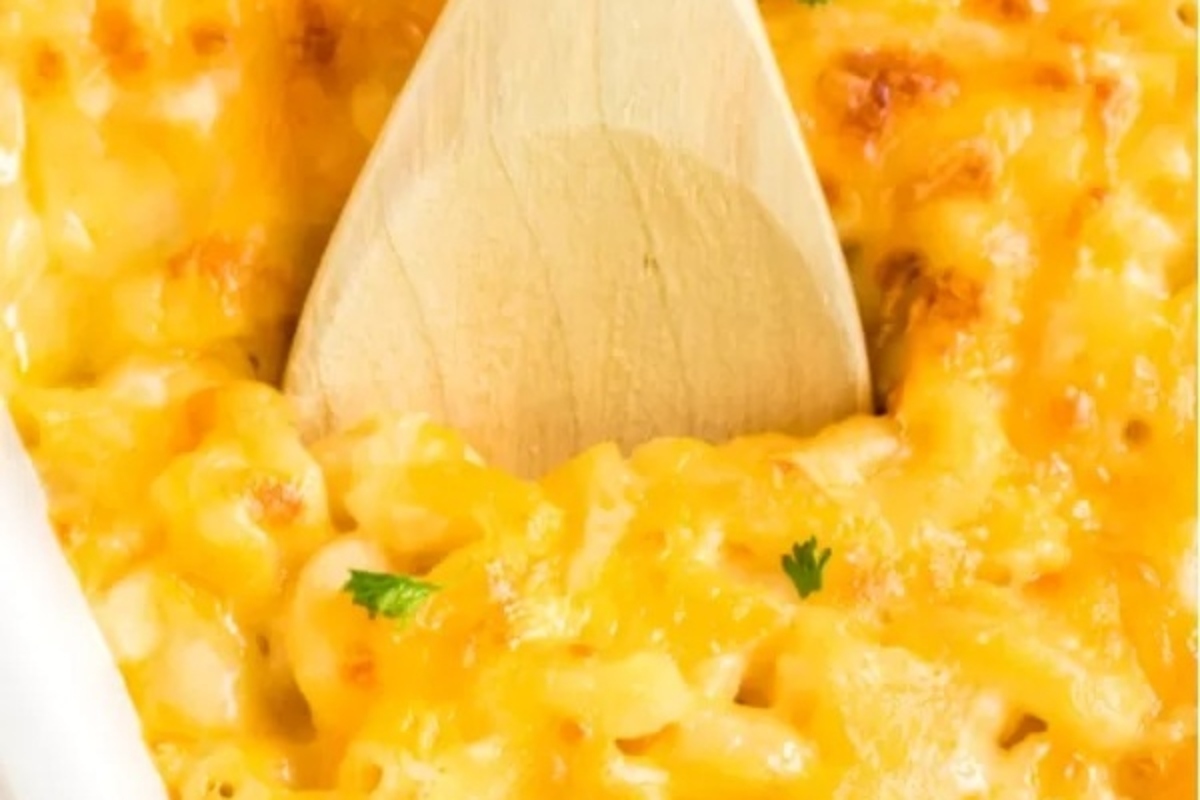 Picky Eater Recipes: Macaroni and cheese in a white dish with a wooden spoon.