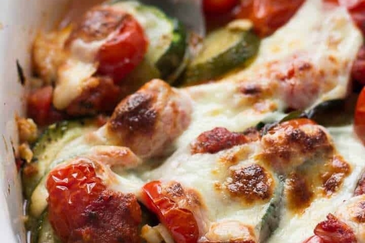 An Italian side dish casserole with tomatoes, zucchini and cheese.