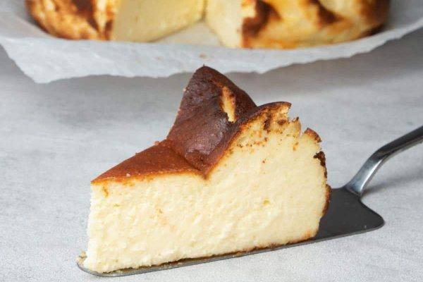 A slice of cheesecake on a plate.