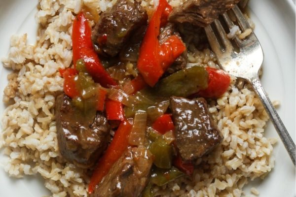 Beef stir fry with peppers and rice.