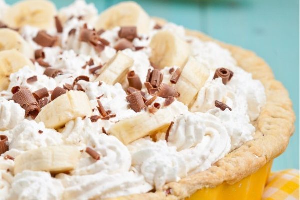 Banana pie with whipped cream and chocolate chips.
