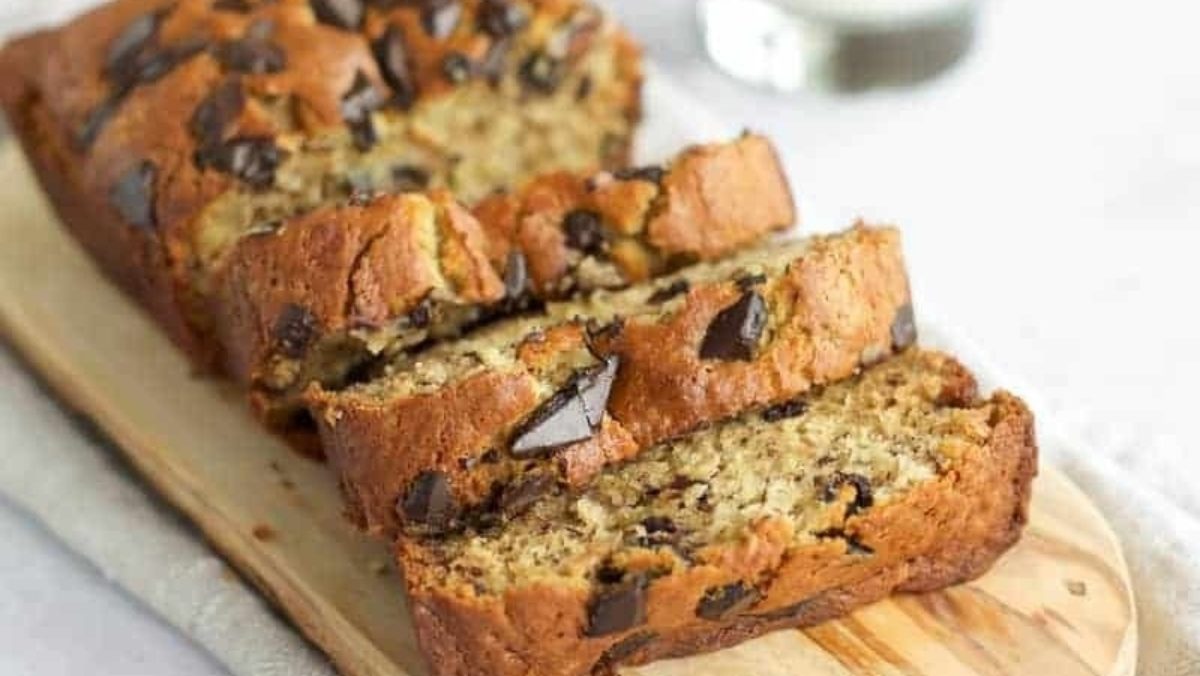 Edible chocolate chip banana bread on a cutting board.