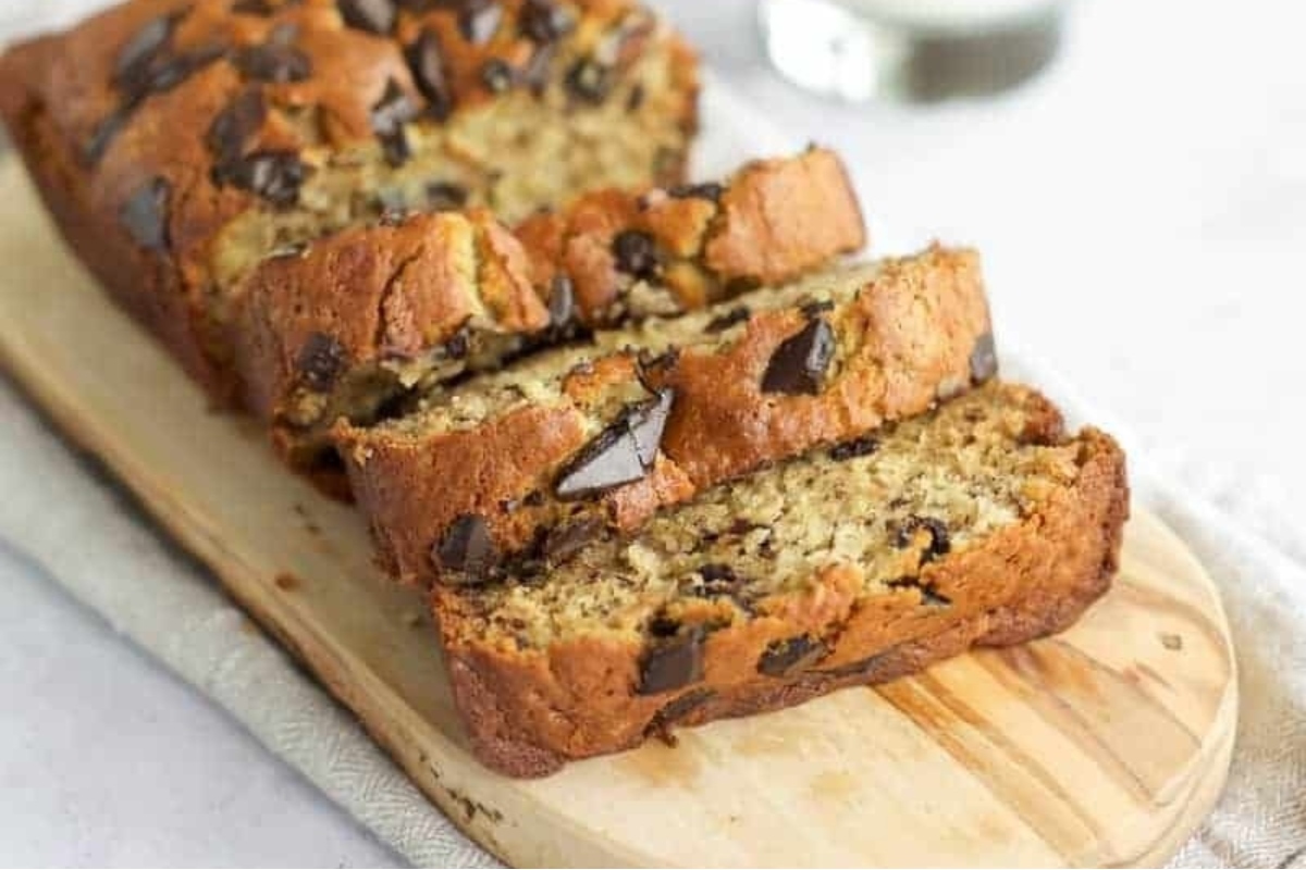 Chocolate chip banana bread on a cutting board. This delicious bread is perfect for breakfast or as a snack. With the perfect balance of chocolate and banana flavors, it is a treat that everyone will