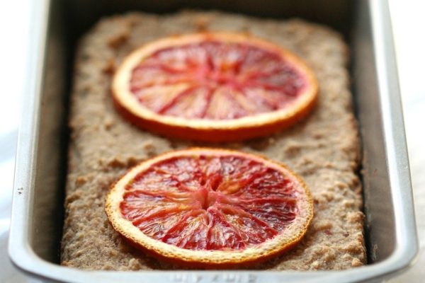 Two slices of blood orange bread in a pan.