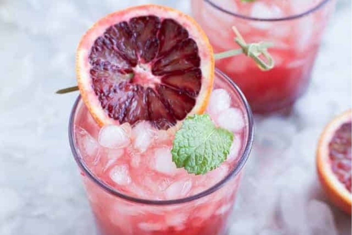 Christmas blood orange margarita with mint garnish.