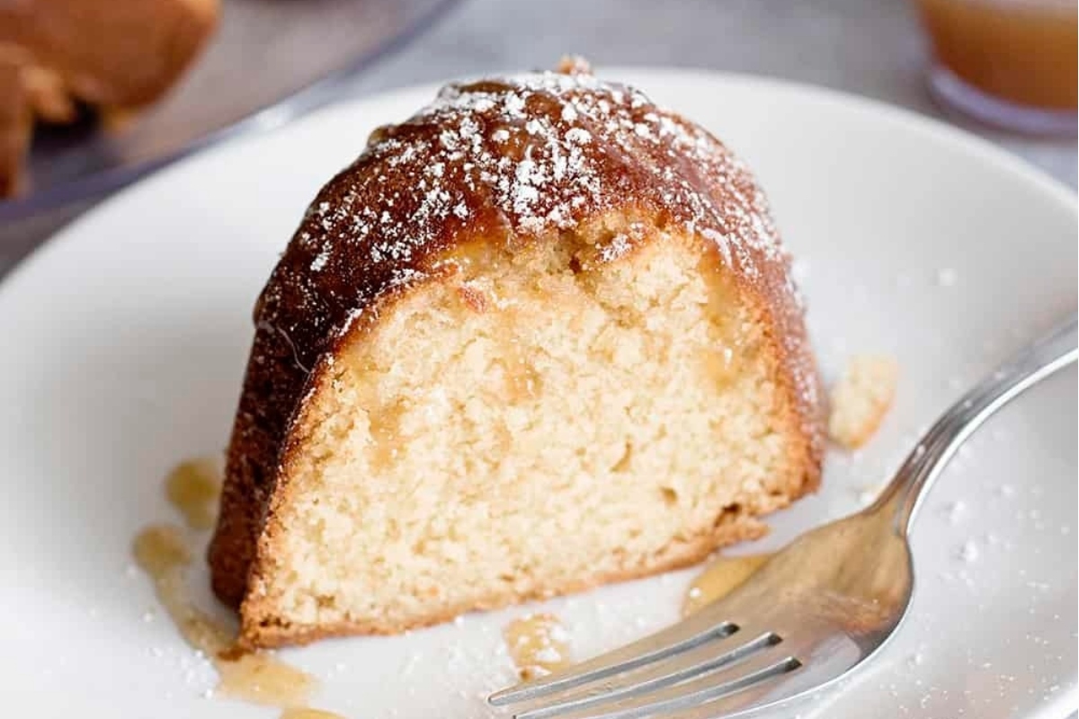 A slice of apple cinnamon bundt cake on a plate.