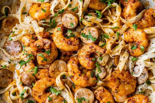 Shrimp and mushroom pasta in a skillet.