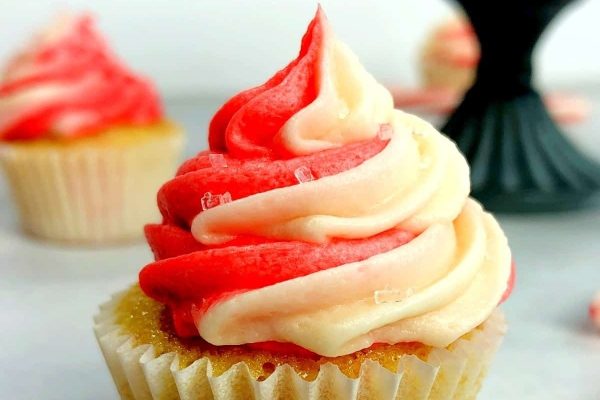 Festive red and white Christmas cupcakes decorated with creamy white icing.