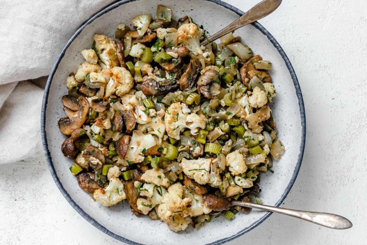 Delicious cauliflower and mushroom stuffing recipe in a bowl.