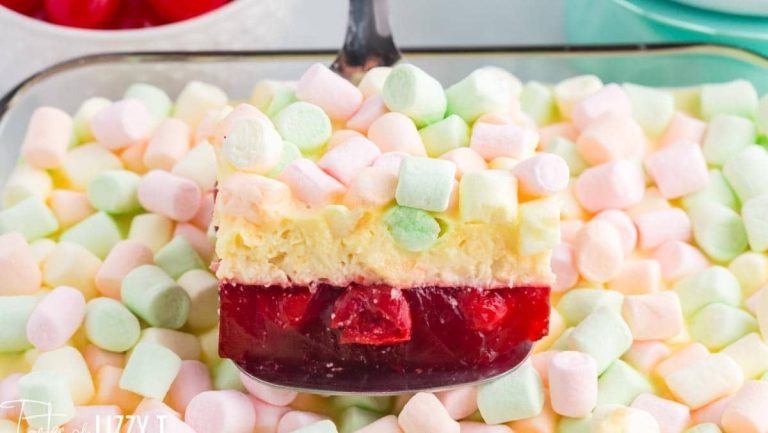 A dessert dish with marshmallows and strawberries on top, perfect for recipes or jello lovers.