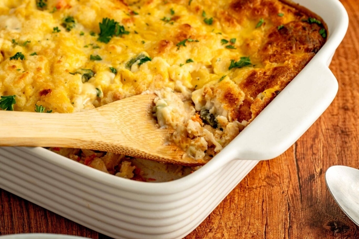 A comforting casserole dish perfect for winter dinners, topped with a wooden spoon.