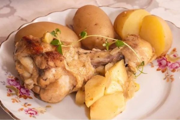 Chicken with potatoes on the side.