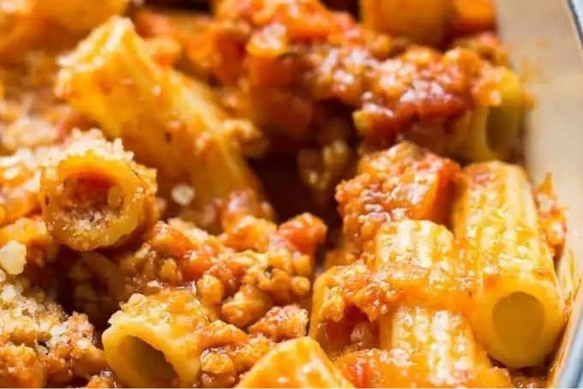 A close up of an Italian pasta dish with meat and sauce, the perfect main course.