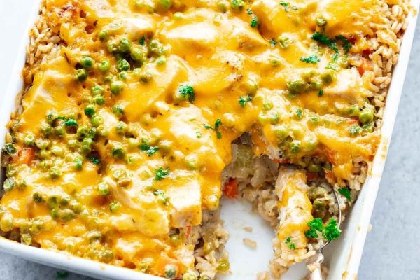 Chicken and rice casserole in a white casserole dish.