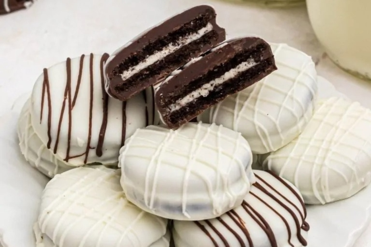 Edible Oreo cookies on a white plate with milk.