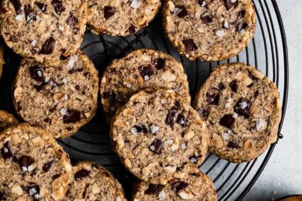 Chocolate chip cookies on a cooling rack.