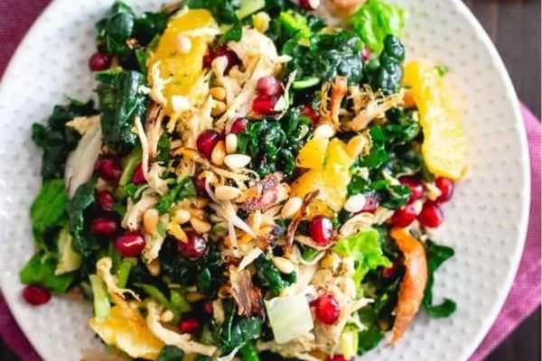 Kale salad with chicken and pomegranate.