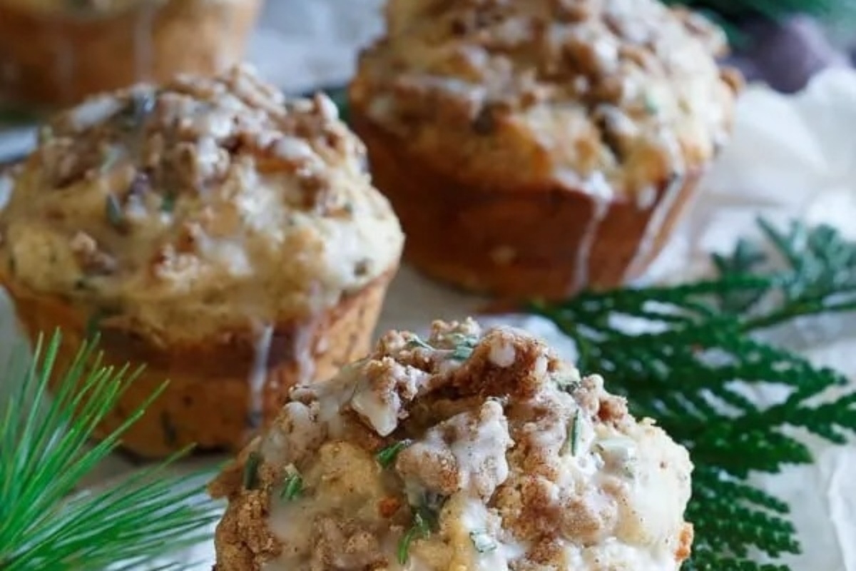 Christmas cranberry muffins on a white plate.