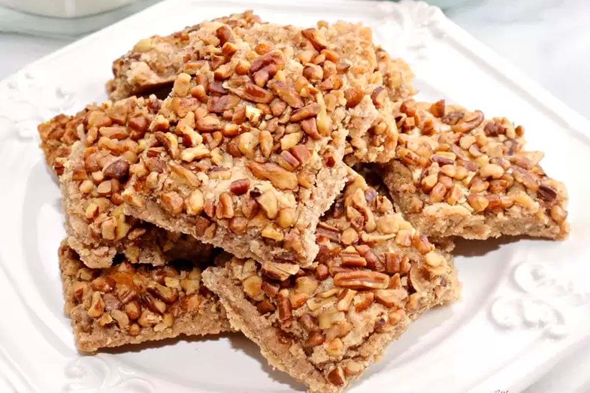 A plate of granola bars with pecans and cinnamon recipes.