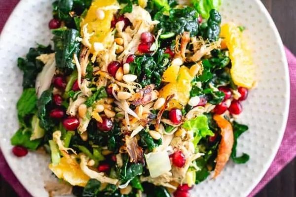 Chicken kale salad with oranges and pomegranate.