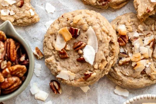 Coconut pecan cookies with a bowl of pecans.