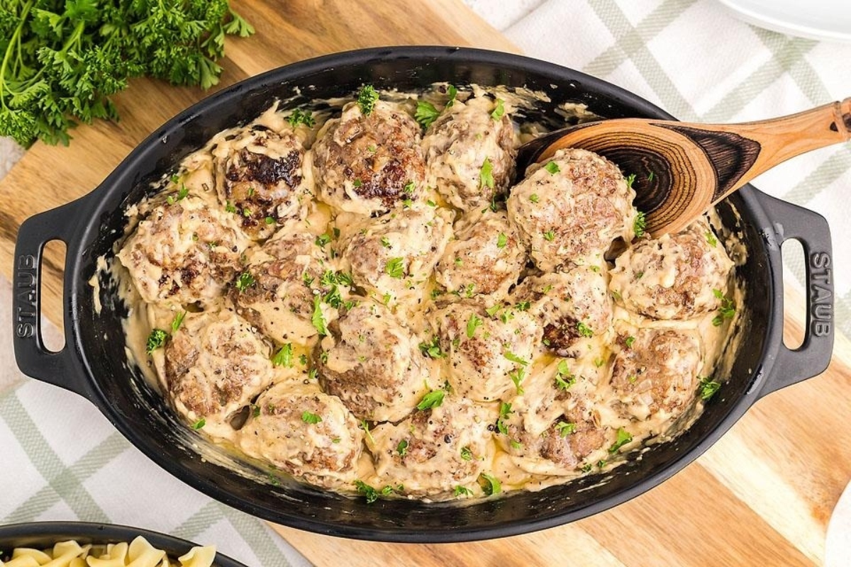 Swedish meatballs in a skillet with pasta and parsley. This is one of the best ground meat recipes.