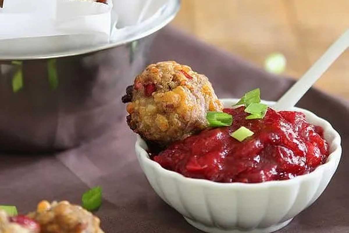 Cranberry meatballs with cranberry sauce in a bowl.