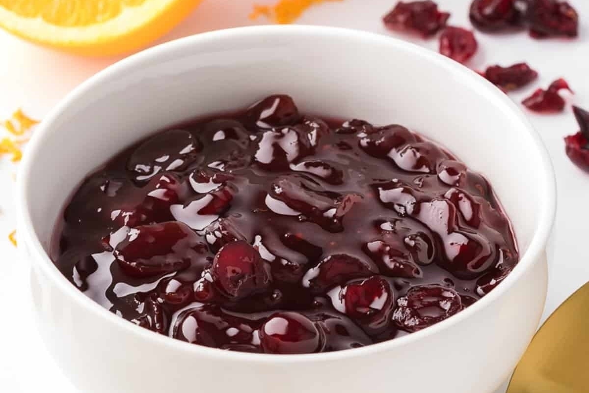 A delightful cranberry sauce served in a white bowl.