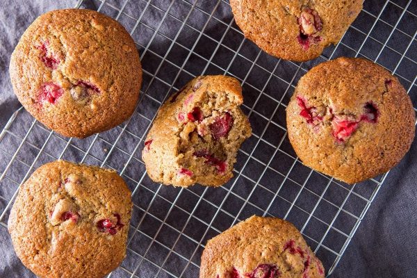 Cranberry muffins on a cooling rack, perfect for breakfast or brunch recipes.