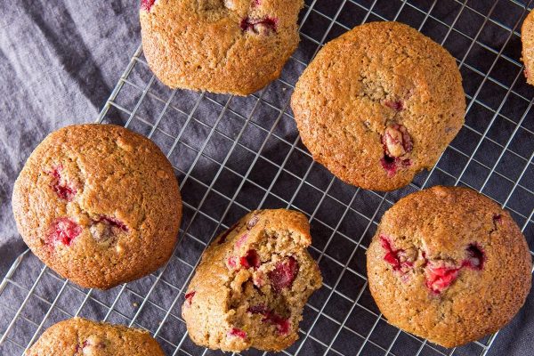 Raspberry muffins on a cooling rack.