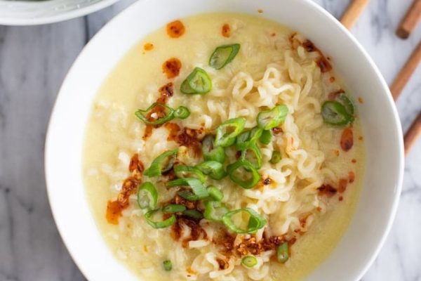 A flavorful bowl of asian noodle soup, traditionally enjoyed using chopsticks.