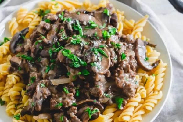Beef stroganoff pasta with mushrooms and parsley.