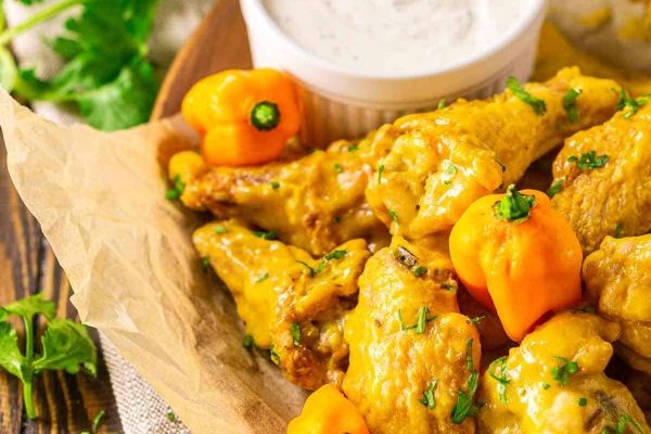 Game Day Wings: Chicken wings with peppers and dipping sauce.