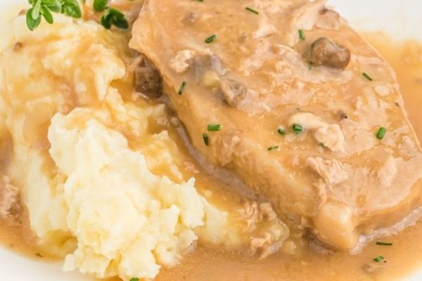 Pork chops with gravy and mashed potatoes.