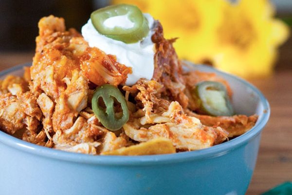 Chicken enchiladas on a plate.
