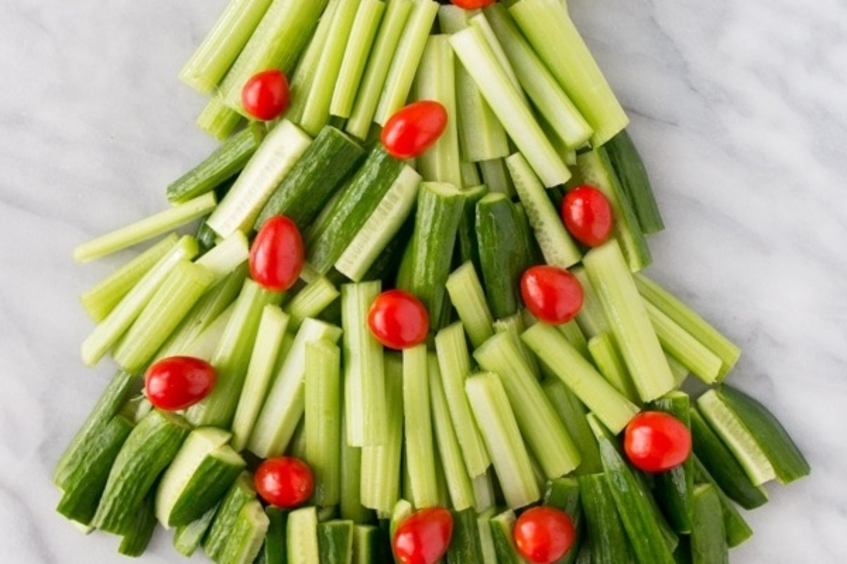 A Christmas tree made out of cucumbers and tomatoes is a festive twist on traditional holiday decorations. This unique and creative centerpiece is perfect for those who want to add a touch of freshness to their Char