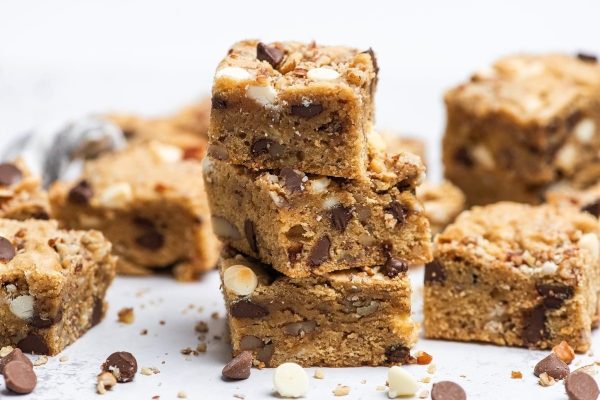 Chocolate chip cookie bars stacked on top of each other.