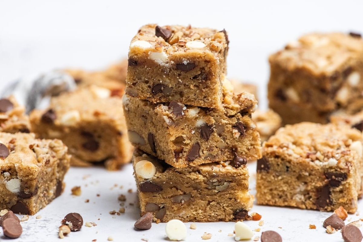 Chocolate chip cookie bars stacked on top of each other.