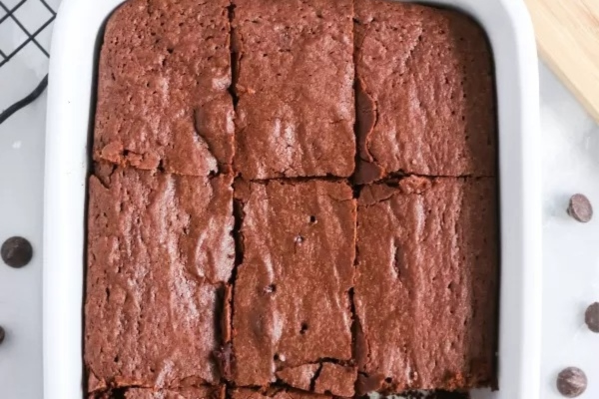 Brownies in a white baking dish with chocolate chips, perfect for indulging in delicious homemade brownies.