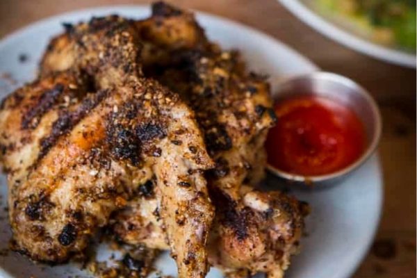 Game Day wings on a wooden table.